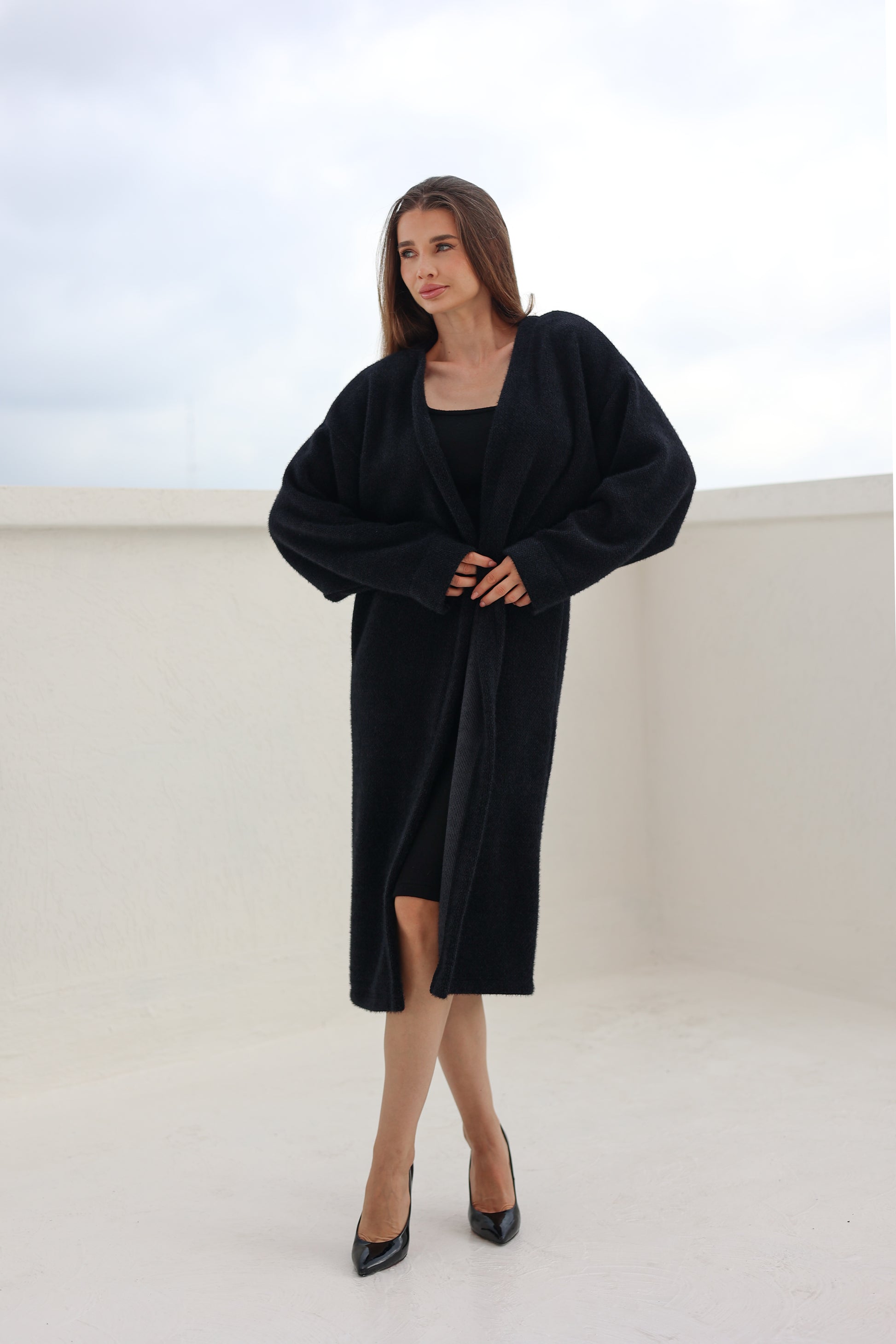 Black fluffy cardigan by FYZE