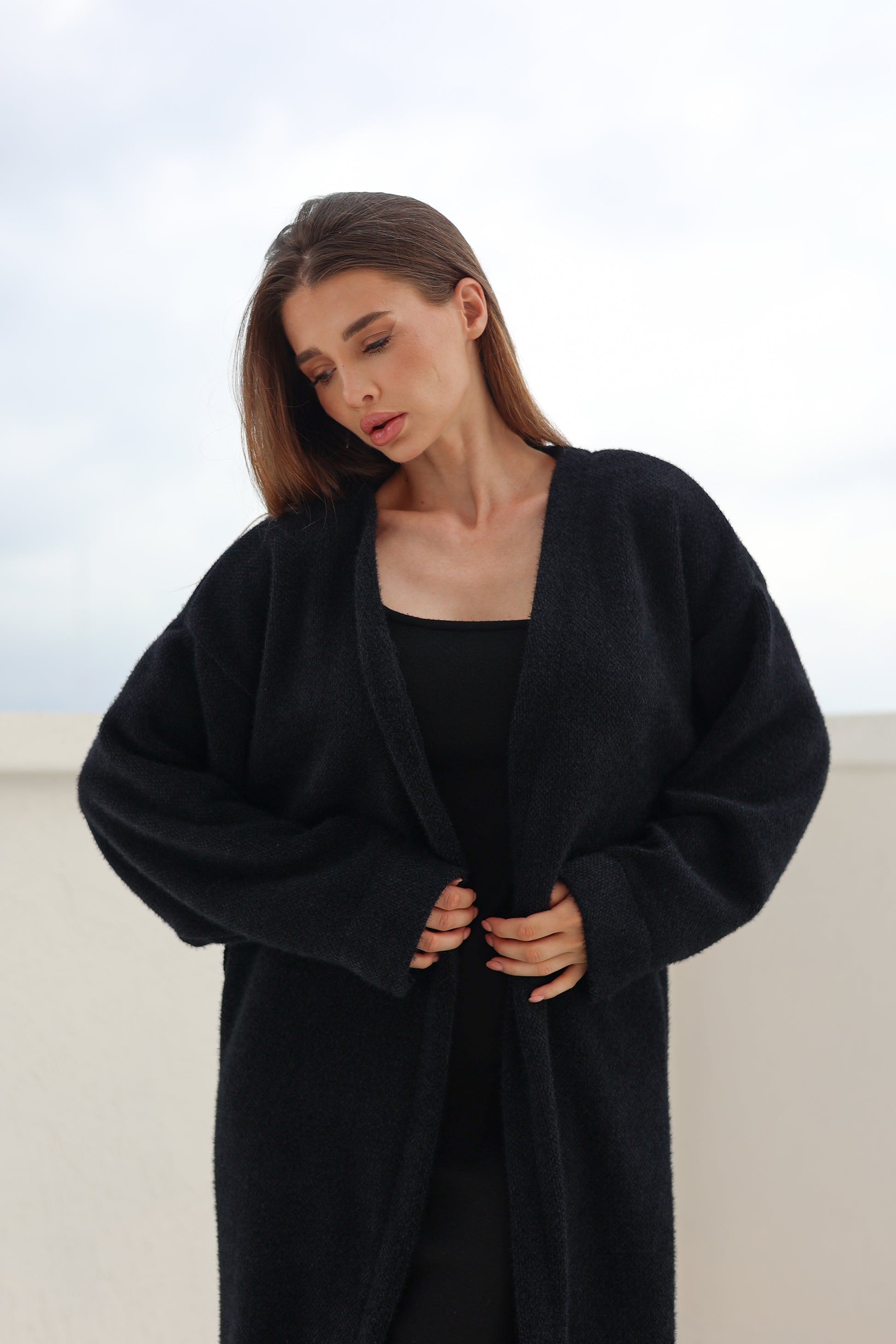 Black fluffy cardigan by FYZE